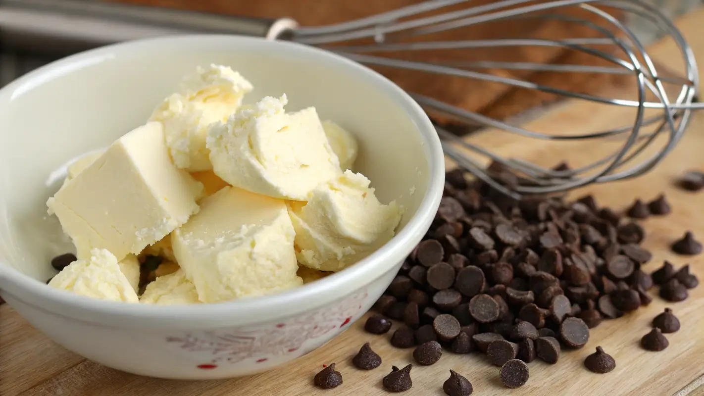 Mixing cream cheese and butter for chocolate chip cheesecake cookies dough.